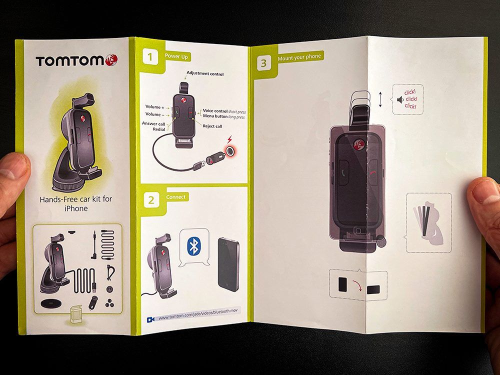Image of TomTom Hand-Free Car Kit Manual open outside view. This is an image related to a project inside Pedro Rodrigues (Treze413) graphic design portfolio.